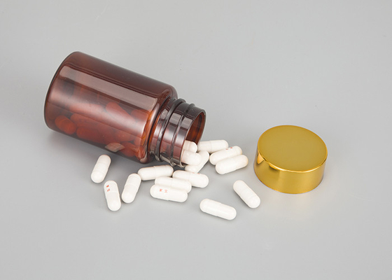 薬のブラウンの子供の証拠の帽子が付いているこはく色の薬剤の丸薬カプセルのびん