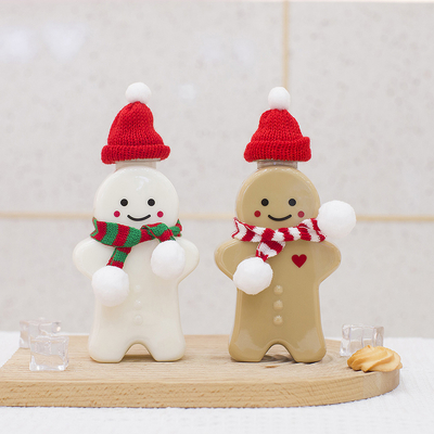 漏れ防止の帽子、空のミルク ティーのびんが付いているクリスマスのプラスチック ジュースのびん