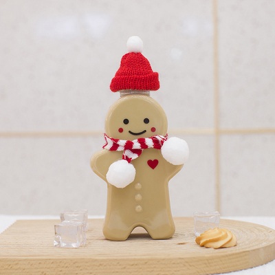 漏れ防止の帽子、空のミルク ティーのびんが付いているクリスマスのプラスチック ジュースのびん