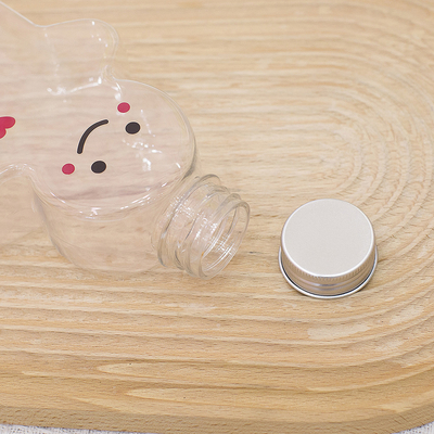 漏れ防止の帽子、空のミルク ティーのびんが付いているクリスマスのプラスチック ジュースのびん