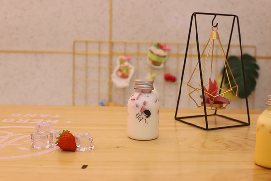 素材と効率の良い飲み物のためのハンドル付きのプラスチック製のミルクティーボトル