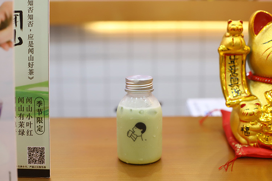 素材と効率の良い飲み物のためのハンドル付きのプラスチック製のミルクティーボトル